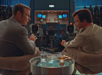 Movie still from “The French Dispatch” (2021), directed by Wes Anderson – Wide shot, Over the shoulder angle