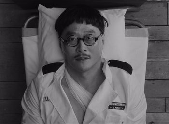 Movie still from “The French Dispatch” (2021), directed by Wes Anderson – Close Up shot, High angle