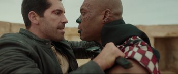 Movie still from “Accident Man: Hitman's Holiday” (2022), directed by George Kirby – Two men are fighting with each other; Close Up shot, Over the shoulder angle