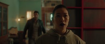 Movie still from “Accident Man: Hitman's Holiday” (2022), directed by George Kirby – A man and a woman standing in front of a mirror; Close Up shot, Over the shoulder angle