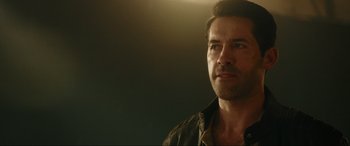 Movie still from “Accident Man: Hitman's Holiday” (2022), directed by George Kirby – A person looking at the camera; Close Up shot, Over the shoulder angle