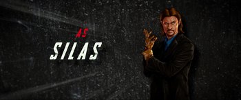 Movie still from “Accident Man: Hitman's Holiday” (2022), directed by George Kirby – A man in a black jacket and a gold glove; Medium shot, Low angle