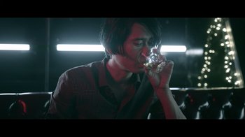 Movie still from “Adverse” (2020), directed by Brian A. Metcalf – A man drinking a glass of wine in a dark room; Close Up shot, Over the shoulder angle