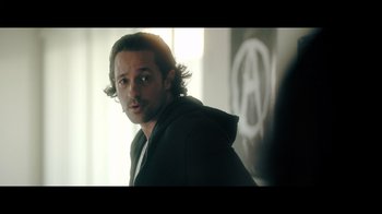 Movie still from “Adverse” (2020), directed by Brian A. Metcalf – A person wearing a hooded jacket; Close Up shot, Over the shoulder angle