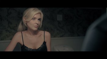 Movie still from “Adverse” (2020), directed by Brian A. Metcalf – A woman sitting in front of a bathroom mirror; Close Up shot, Over the shoulder angle