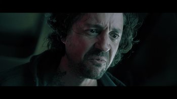 Movie still from “Adverse” (2020), directed by Brian A. Metcalf – A person with long hair; Close Up shot, Low angle