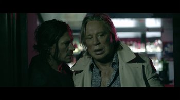 Movie still from “Adverse” (2020), directed by Brian A. Metcalf – Two people standing next to each other in a dark room; Close Up shot, Over the shoulder angle