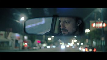 Movie still from “Adverse” (2020), directed by Brian A. Metcalf – A man looking out of the window of a car at night; Close Up shot, Low angle