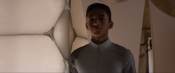Movie still from “After Earth” (2013), directed by M. Night Shyamalan – A young man in a white shirt is looking at the camera; Close Up shot, Low angle