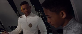Movie still from “After Earth” (2013), directed by M. Night Shyamalan – A man in a white shirt is looking at another man in a white shirt; Close Up shot, Over the shoulder angle