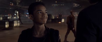 Movie still from “After Earth” (2013), directed by M. Night Shyamalan – A young man is looking up at the sky; Close Up shot, Over the shoulder angle