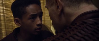 Movie still from “After Earth” (2013), directed by M. Night Shyamalan – A man and a boy are looking at one another; Close Up shot, Over the shoulder angle