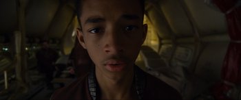 Movie still from “After Earth” (2013), directed by M. Night Shyamalan – A young man's face in the dark; Close Up shot, Low angle
