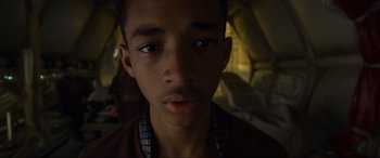 Movie still from “After Earth” (2013), directed by M. Night Shyamalan – A young man's face in the dark; Close Up shot, Low angle
