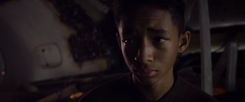 Movie still from “After Earth” (2013), directed by M. Night Shyamalan – A young person with a dark background; Close Up shot, Low angle