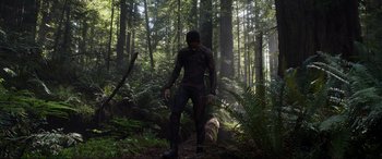 Movie still from “After Earth” (2013), directed by M. Night Shyamalan – A man standing in the middle of a forest; Wide shot, Low angle