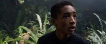 Movie still from “After Earth” (2013), directed by M. Night Shyamalan – A young man is looking up at the sky; Close Up shot, Over the shoulder angle