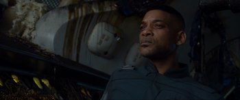 Movie still from “After Earth” (2013), directed by M. Night Shyamalan – A person wearing a uniform looking up; Close Up shot, Low angle