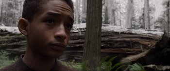 Movie still from “After Earth” (2013), directed by M. Night Shyamalan – A young man is looking into the distance; Close Up shot, Low angle