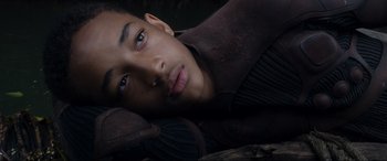 Movie still from “After Earth” (2013), directed by M. Night Shyamalan – A person laying on the ground; Close Up shot, High angle