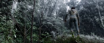 Movie still from “After Earth” (2013), directed by M. Night Shyamalan – A man walking through the woods; Wide shot, Low angle