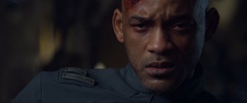 Movie still from “After Earth” (2013), directed by M. Night Shyamalan – A person with a head wound; Close Up shot, Over the shoulder angle