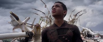 Movie still from “After Earth” (2013), directed by M. Night Shyamalan – A young man standing in front of a bunch of fire hydrants; Close Up shot, Low angle