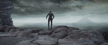 Movie still from “After Earth” (2013), directed by M. Night Shyamalan – A man standing on top of a rock cliff; Extreme Wide shot, Low angle