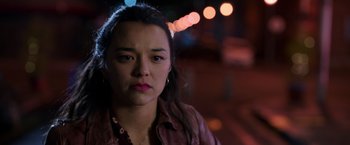 Movie still from “Afterlife of the Party” (2021), directed by Stephen Herek – A young woman is looking at the camera; Close Up shot, Over the shoulder angle