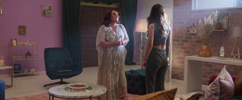 Movie still from “Afterlife of the Party” (2021), directed by Stephen Herek – Two women standing next to each other in front of a mirror; Medium shot, Over the shoulder angle