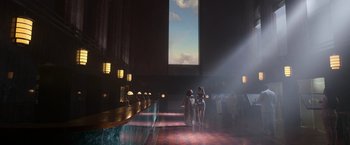 Movie still from “Afterlife of the Party” (2021), directed by Stephen Herek – A group of people standing in front of a large window; Extreme Wide shot, Low angle