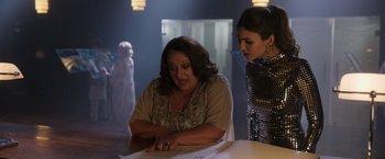 Movie still from “Afterlife of the Party” (2021), directed by Stephen Herek – Two women are looking at a piece of paper; Medium shot, Over the shoulder angle