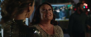 Movie still from “Afterlife of the Party” (2021), directed by Stephen Herek – An older woman is looking up at the sky; Close Up shot, Over the shoulder angle