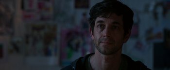 Movie still from “Afterlife of the Party” (2021), directed by Stephen Herek – A person wearing a black shirt; Close Up shot, Over the shoulder angle