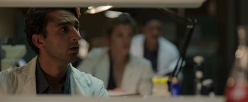 Movie still from “Afterlife of the Party” (2021), directed by Stephen Herek – A group of people sitting around a table; Close Up shot, Over the shoulder angle