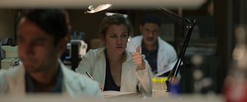 Movie still from “Afterlife of the Party” (2021), directed by Stephen Herek – A woman in a lab coat giving a thumbs up; Medium shot, Low angle