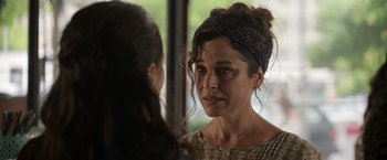 Movie still from “Afterlife of the Party” (2021), directed by Stephen Herek – A woman looking at her reflection in a mirror; Close Up shot, Over the shoulder angle
