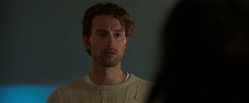 Movie still from “Afterlife of the Party” (2021), directed by Stephen Herek – A person wearing a sweater; Close Up shot, Over the shoulder angle