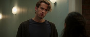 Movie still from “Afterlife of the Party” (2021), directed by Stephen Herek – A man with a beard is standing in a room; Close Up shot, Over the shoulder angle