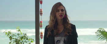 Movie still from “Afterlife of the Party” (2021), directed by Stephen Herek – A beautiful young lady standing next to the ocean; Close Up shot, Over the shoulder angle