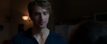 Movie still from “Afterlife of the Party” (2021), directed by Stephen Herek – A person wearing a blue shirt; Close Up shot, Over the shoulder angle