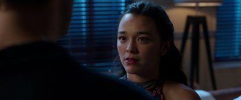 Movie still from “Afterlife of the Party” (2021), directed by Stephen Herek – A person sitting in front of a window; Close Up shot, Over the shoulder angle