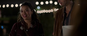 Movie still from “Afterlife of the Party” (2021), directed by Stephen Herek – A woman and a man standing next to each other on a street; Close Up shot, Over the shoulder angle