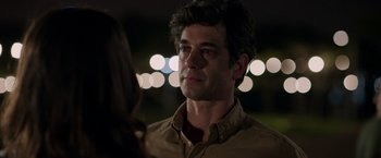 Movie still from “Afterlife of the Party” (2021), directed by Stephen Herek – A person wearing a brown button up shirt; Close Up shot, Over the shoulder angle