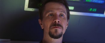 Movie still from “Air Force One” (1997), directed by Wolfgang Petersen – A person with a beard; Close Up shot, Low angle