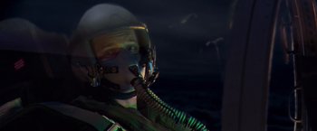 Movie still from “Air Force One” (1997), directed by Wolfgang Petersen – A man wearing a helmet and a gas mask is in the dark; Close Up shot, Low angle