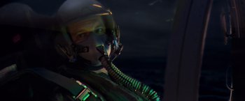 Movie still from “Air Force One” (1997), directed by Wolfgang Petersen – A man wearing a helmet and a gas mask in the dark; Medium shot, Low angle