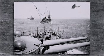 Movie still from “Aircraft Carrier: Guardian of the Seas” (2016), directed by Stephen Low – A black - and - white photo of a boat in the ocean; Extreme Wide shot, High angle