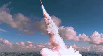 Movie still from “Aircraft Carrier: Guardian of the Seas” (2016), directed by Stephen Low – An image of a rocket launching into the sky; Extreme Wide shot, Low angle