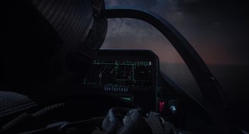 Movie still from “Aircraft Carrier: Guardian of the Seas” (2016), directed by Stephen Low – A view from inside an airplane cockpit at night; Wide shot, High angle